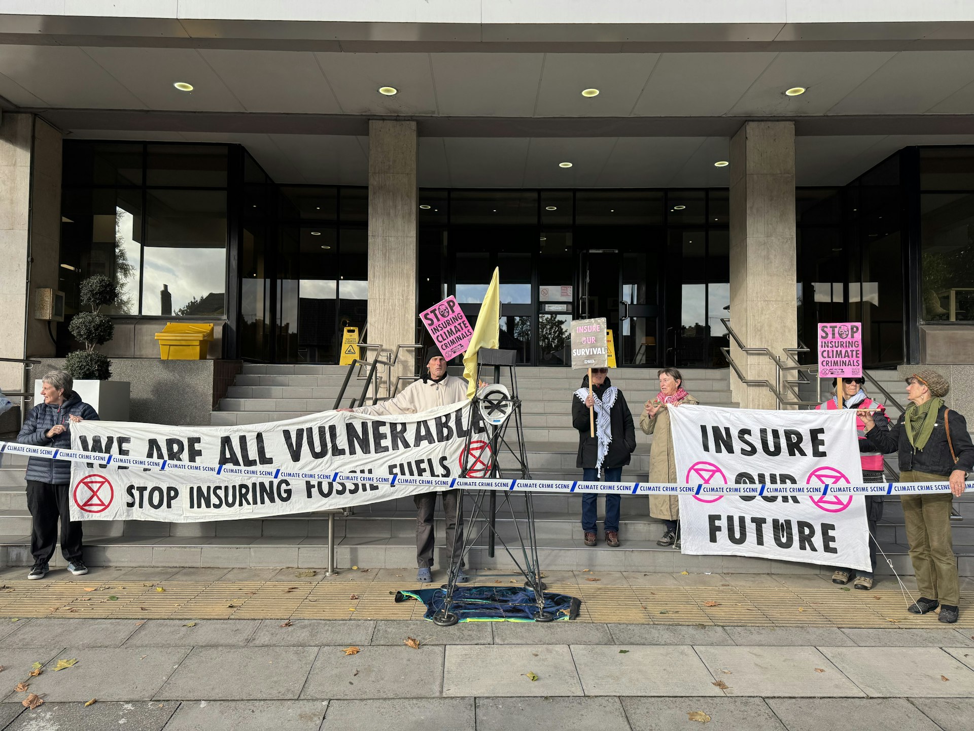 Extinction Rebellion activists outside AXA's offices on Civic Drive, Ipswich